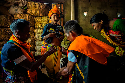 A boy wears Tiwa tribal attire